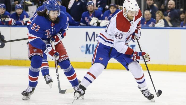 Feb 15, 2024; New York, New York, USA; Montreal Canadiens right wing Joel Armia (40) skates past New York Rangers center Mika Zibanejad (93) on a breakaway in the first period at Madison Square Garden. Mandatory Credit: Wendell Cruz-USA TODAY Sports