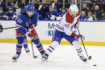 Feb 15, 2024; New York, New York, USA; Montreal Canadiens right wing Joel Armia (40) skates past New York Rangers center Mika Zibanejad (93) on a breakaway in the first period at Madison Square Garden. Mandatory Credit: Wendell Cruz-USA TODAY Sports