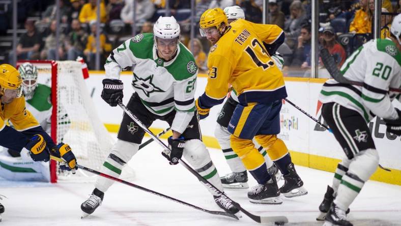 Feb 15, 2024; Nashville, Tennessee, USA; Dallas Stars left wing Mason Marchment (27) skates with the puck  against the Nashville Predators during the first period at Bridgestone Arena. Mandatory Credit: Steve Roberts-USA TODAY Sports