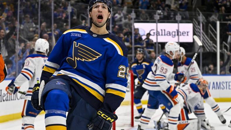 Feb 15, 2024; St. Louis, Missouri, USA;  St. Louis Blues center Jordan Kyrou (25) reacts after scoring against Edmonton Oilers goaltender Stuart Skinner (74) during the second period at Enterprise Center. Mandatory Credit: Jeff Curry-USA TODAY Sports