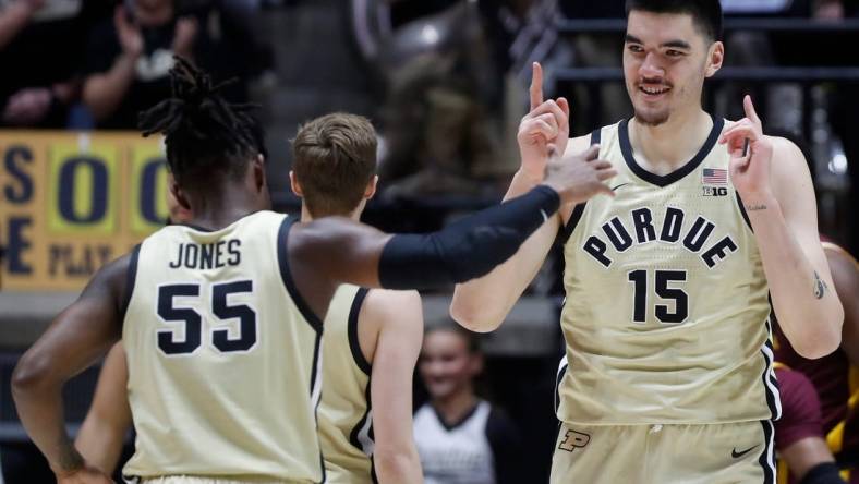 Purdue Boilermakers guard Lance Jones (55) and Purdue Boilermakers center Zach Edey (15) celebrate during the NCAA men   s basketball game against the Minnesota Golden Gophers, Thursday, Feb. 15, 2024, at Mackey Arena in West Lafayette, Ind.