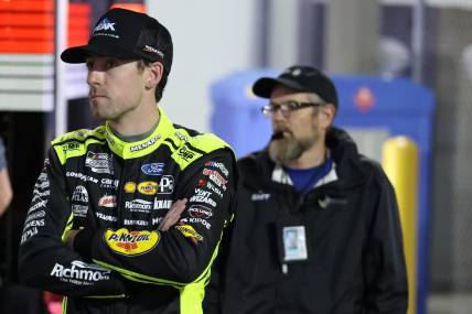 Feb 15, 2024; Daytona Beach, Florida, USA; NASCAR Cup Series driver Ryan Blaney (12) in the garage area after wrecking during the Bluegreen Vacations Duel 2 at Daytona International Speedway. Mandatory Credit: Peter Casey-USA TODAY Sports
