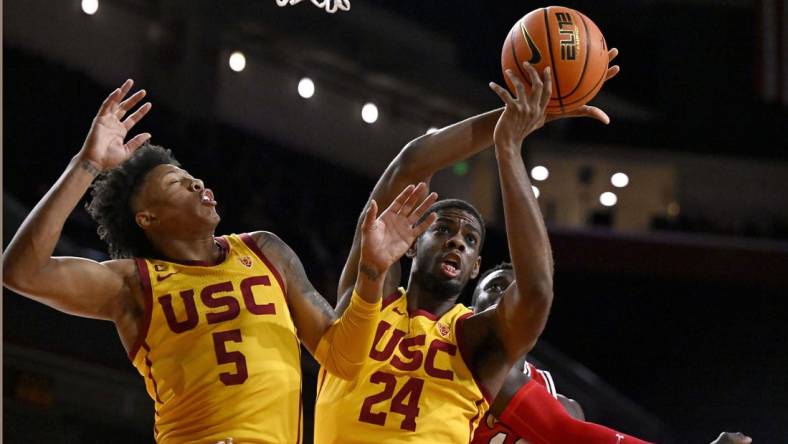 Feb 15, 2024; Los Angeles, California, USA; Southern California Trojans forward Joshua Morgan (24) gets a rebound with guard Boogie Ellis (5) against Utah Utes center Keba Keita (13) during the first half at Galen Center. Mandatory Credit: Alex Gallardo-USA TODAY Sports