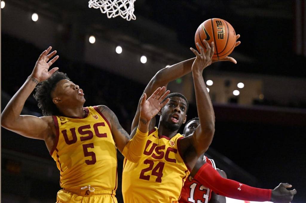 Feb 15, 2024; Los Angeles, California, USA; Southern California Trojans forward Joshua Morgan (24) gets a rebound with guard Boogie Ellis (5) against Utah Utes center Keba Keita (13) during the first half at Galen Center. Mandatory Credit: Alex Gallardo-USA TODAY Sports