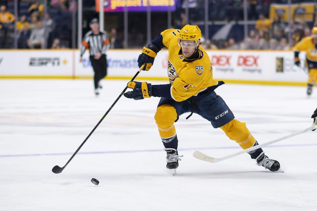 Feb 15, 2024; Nashville, Tennessee, USA; Nashville Predators left wing Mark Jankowski (17) skates with the puck  during the third period at Bridgestone Arena. Mandatory Credit: Steve Roberts-USA TODAY Sports