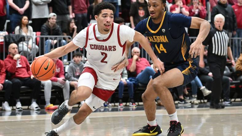 Feb 15, 2024; Pullman, Washington, USA; Washington State Cougars guard Myles Rice (2) runs the baseline against California Golden Bears forward Grant Newell (14) in the second half at Friel Court at Beasley Coliseum. Washington State Cougars won 84-65. Mandatory Credit: James Snook-USA TODAY Sports