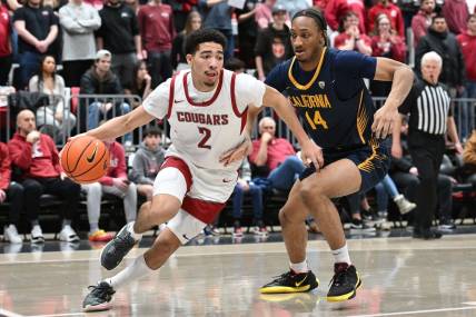Feb 15, 2024; Pullman, Washington, USA; Washington State Cougars guard Myles Rice (2) runs the baseline against California Golden Bears forward Grant Newell (14) in the second half at Friel Court at Beasley Coliseum. Washington State Cougars won 84-65. Mandatory Credit: James Snook-USA TODAY Sports