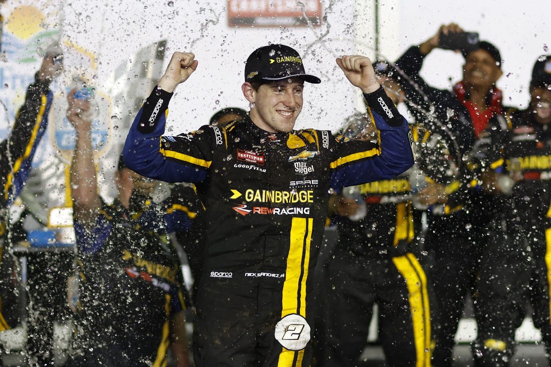 Feb 16, 2024; Daytona Beach, Florida, USA; NASCAR Truck Series driver Nick Sanchez (2) reacts in victory lane after winning the Fresh From Florida 250 at Daytona International Speedway. Mandatory Credit: Peter Casey-USA TODAY Sports