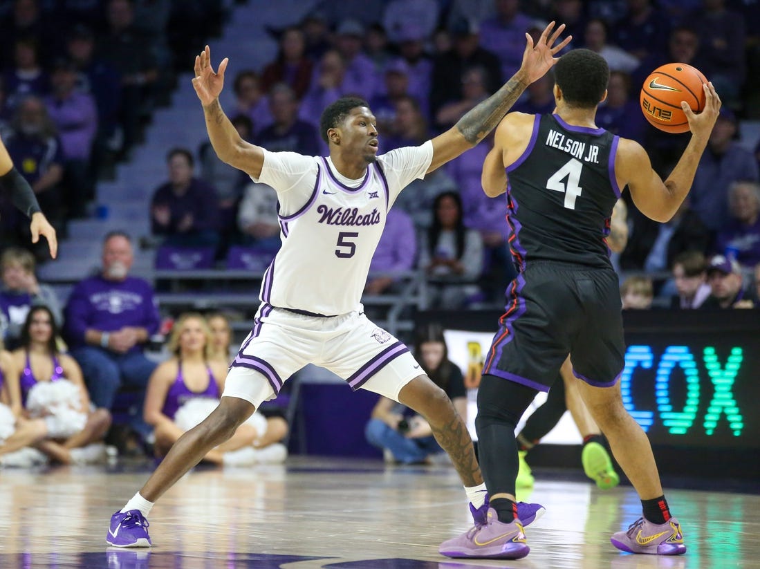 Feb 17, 2024; Manhattan, Kansas, USA; Kansas State Wildcats guard Cam Carter (5) guards TCU Horned Frogs guard Jameer Nelson Jr. (4) during the first half at Bramlage Coliseum. Mandatory Credit: Scott Sewell-USA TODAY Sports