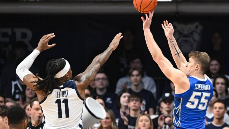 Feb 17, 2024; Indianapolis, Indiana, USA;  Creighton Bluejays guard Baylor Scheierman (55) attempts a shot over Butler Bulldogs guard Jahmyl Telfort (11) during the first half at Hinkle Fieldhouse. Mandatory Credit: Robert Goddin-USA TODAY Sports