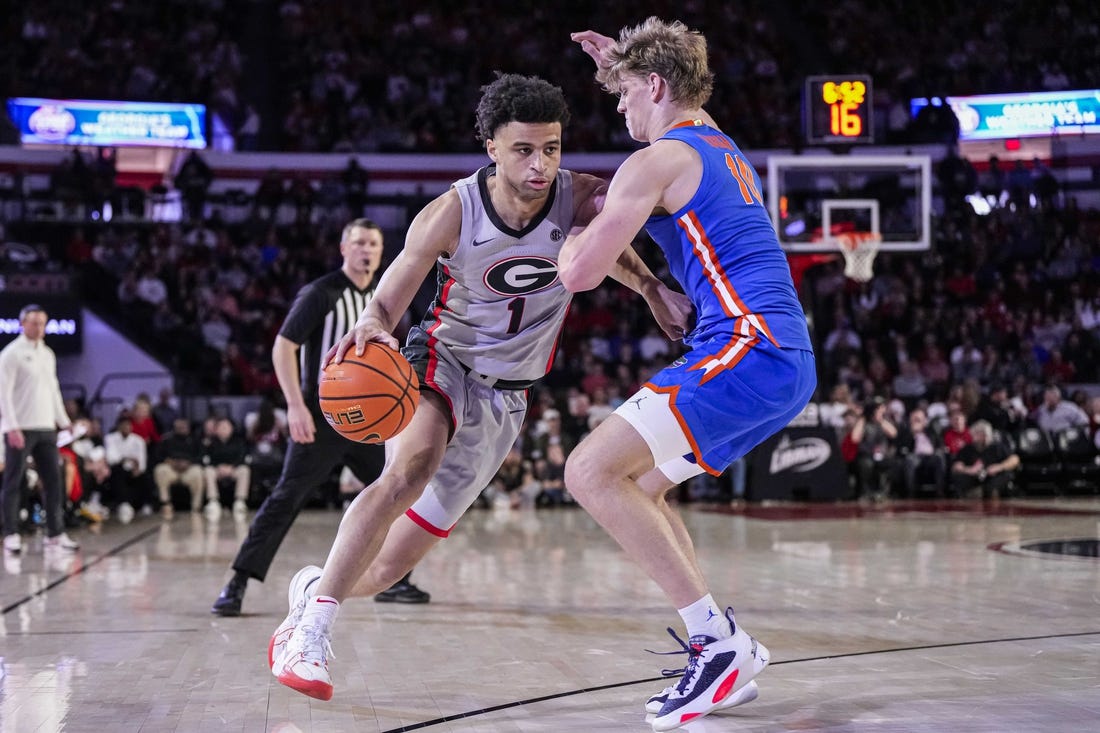 Feb 17, 2024; Athens, Georgia, USA; Georgia Bulldogs guard Jabri Abdur-Rahim (1) dribbles against Florida Gators forward Thomas Haugh (10) during the first half at Stegeman Coliseum. Mandatory Credit: Dale Zanine-USA TODAY Sports