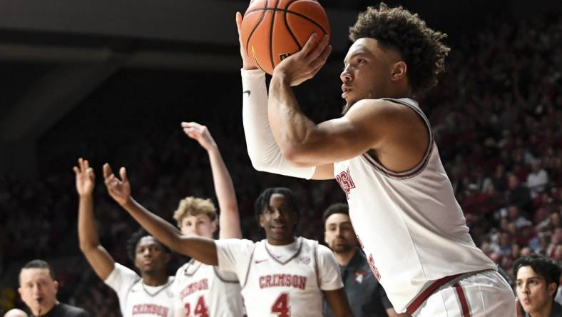 Feb 17, 2024; Tuscaloosa, Alabama, USA;  Alabama Crimson Tide guard Mark Sears (1) shoots a three point shot against the Texas A&M Aggies during the second half at Coleman Coliseum. Alabama won 100-75. Mandatory Credit: Gary Cosby Jr.-USA TODAY Sports