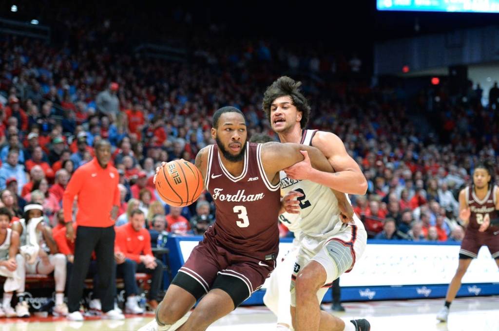 Feb 17, 2024; Dayton, Ohio, USA; Fordham Rams guard Jahmere Tripp (3) drives against Dayton Flyers forward Nate Santos (2) during a game at University of Dayton Arena. Mandatory Credit: Matt Lunsford-USA TODAY Sports