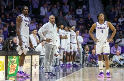 Feb 17, 2024; Manhattan, Kansas, USA; Kansas State Wildcats head coach Jerome Tang, forward Arthur Maluma (24) and guard Dai Dai Ames (4) watch as the TCU Horned Frogs shoots free throws during the second half at Bramlage Coliseum. Mandatory Credit: Scott Sewell-USA TODAY Sports