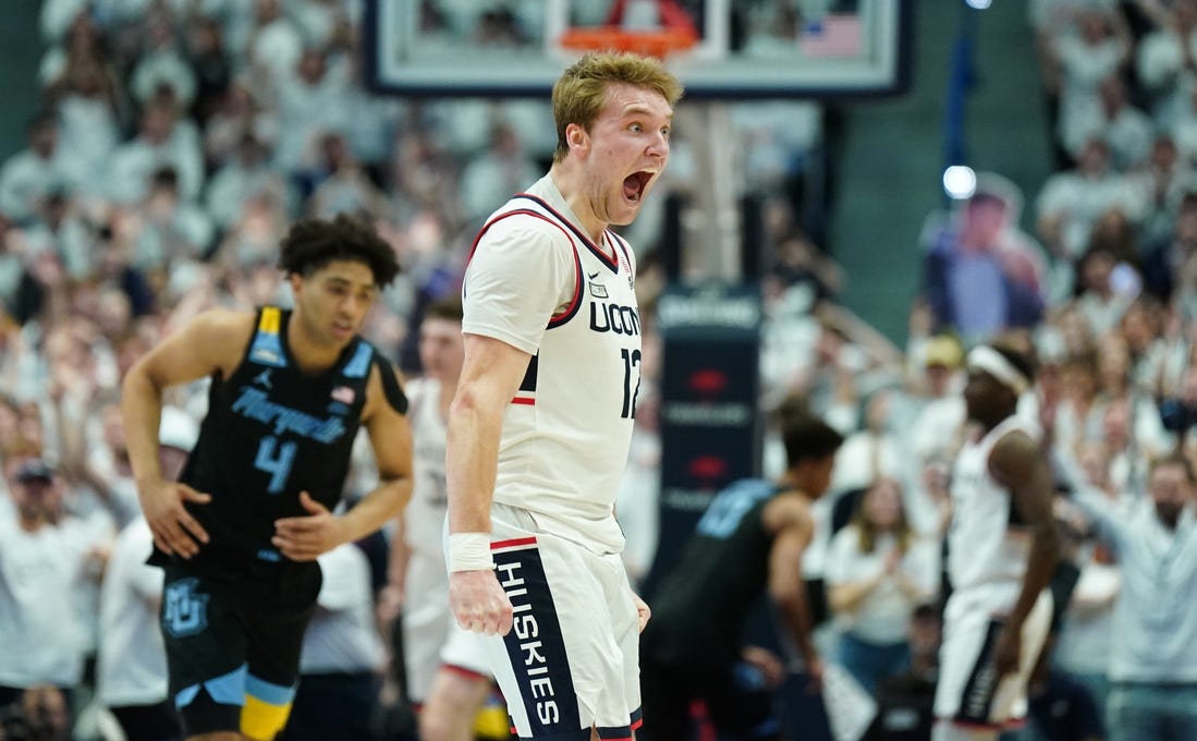 Feb 17, 2024; Hartford, Connecticut, USA; UConn Huskies guard Cam Spencer (12) reacts after a play against the Marquette Golden Eagles in the first half at XL Center. Mandatory Credit: David Butler II-USA TODAY Sports