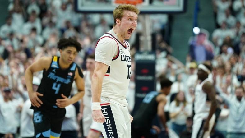 Feb 17, 2024; Hartford, Connecticut, USA; UConn Huskies guard Cam Spencer (12) reacts after a play against the Marquette Golden Eagles in the first half at XL Center. Mandatory Credit: David Butler II-USA TODAY Sports