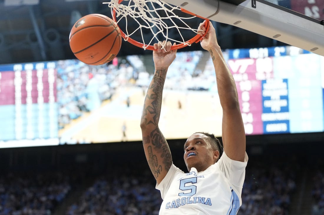 Feb 17, 2024; Chapel Hill, North Carolina, USA; North Carolina Tar Heels forward Armando Bacot (5) scores in the second half at Dean E. Smith Center. Mandatory Credit: Bob Donnan-USA TODAY Sports