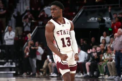 Feb 17, 2024; Starkville, Mississippi, USA; Mississippi State Bulldogs guard Josh Hubbard (13) reacts after a three point basket against the Arkansas Razorbacks during the second half at Humphrey Coliseum. Mandatory Credit: Petre Thomas-USA TODAY Sports