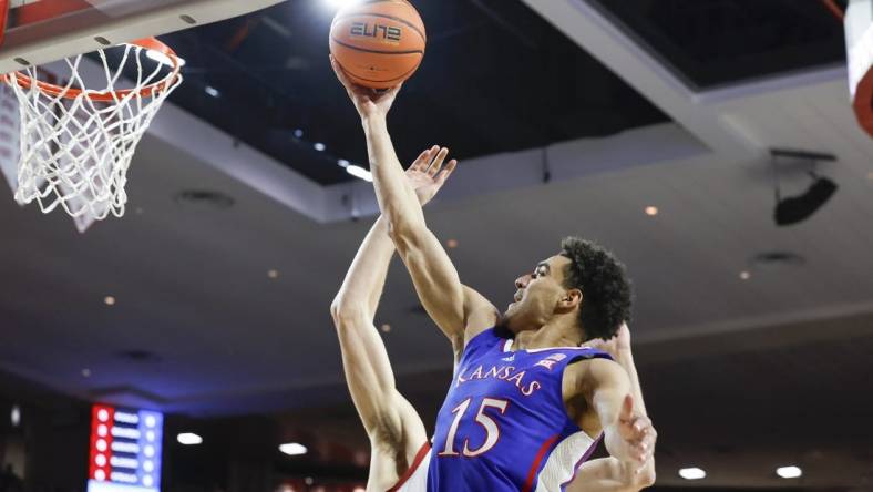 Feb 17, 2024; Norman, Oklahoma, USA; Kansas Jayhawks guard Kevin McCullar Jr. (15) goes to the basket against the Oklahoma Sooners during the first half at Lloyd Noble Center. Mandatory Credit: Alonzo Adams-USA TODAY Sports