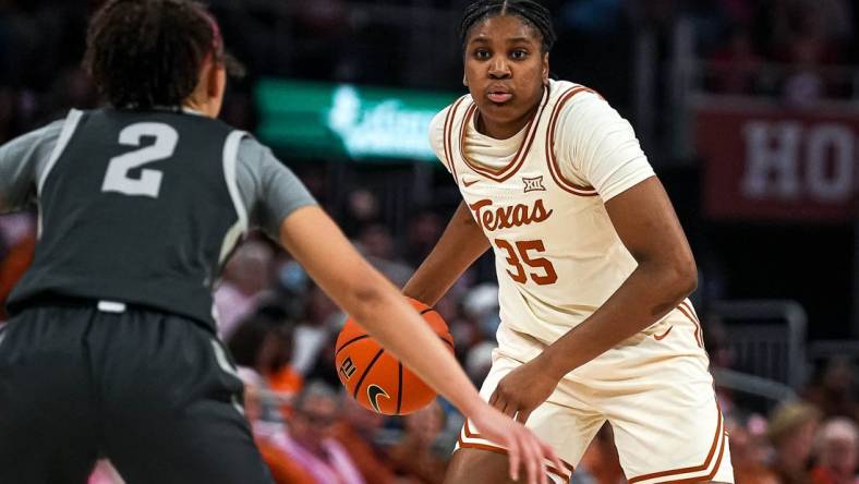 Texas Longhorns guard Madison Booker (35) looks for an open team mate for a pass during the basketball game against Iowa State at the Moody Center on Saturday, Feb. 17, 2024 in Austin.