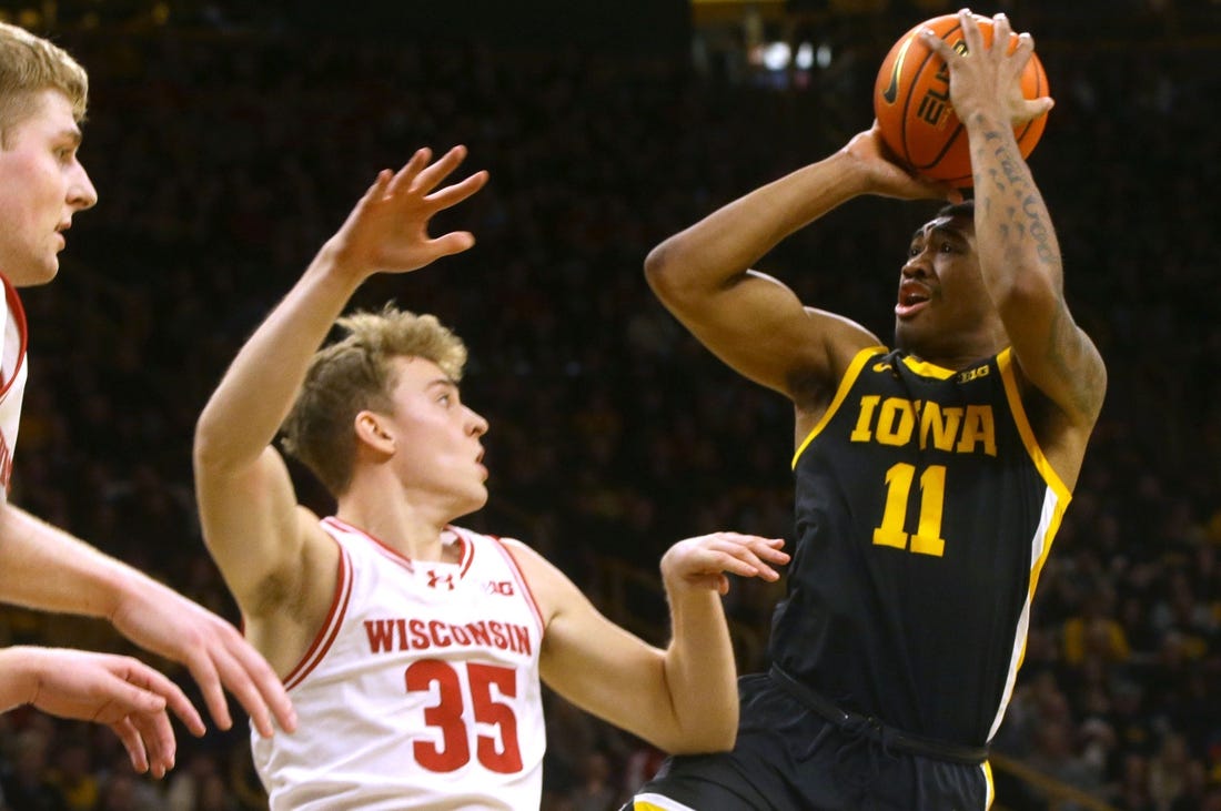 Iowa   s Tony Perkins (11) shoots against Wisconsin Saturday, Feb. 17, 2024 at Carver-Hawkeye Arena in Iowa City, Iowa.