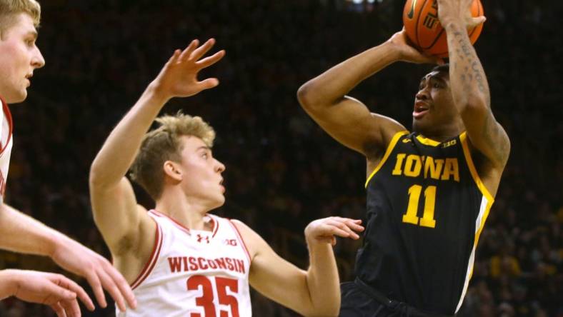 Iowa   s Tony Perkins (11) shoots against Wisconsin Saturday, Feb. 17, 2024 at Carver-Hawkeye Arena in Iowa City, Iowa.