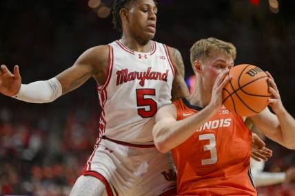 Feb 17, 2024; College Park, Maryland, USA;  Illinois Fighting Illini forward Marcus Domask (3) looks to pass as Maryland Terrapins guard DeShawn Harris-Smith (5) defends during the first  half at Xfinity Center. Mandatory Credit: Tommy Gilligan-USA TODAY Sports