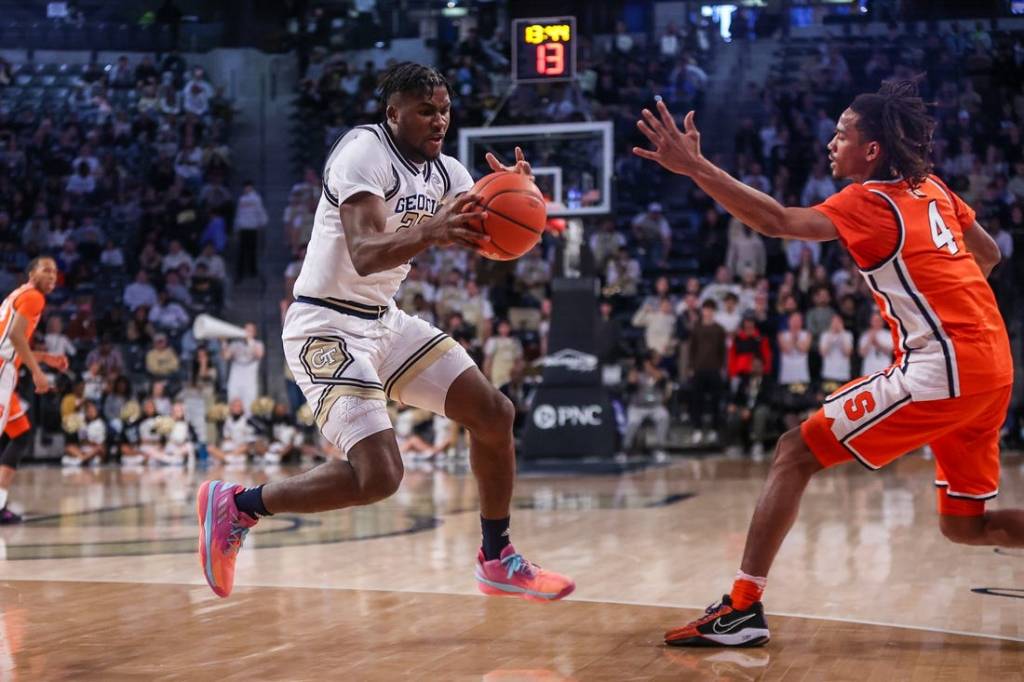 Feb 17, 2024; Atlanta, Georgia, USA; Georgia Tech Yellow Jackets forward Ibrahima Sacko (23) grabs the ball from Syracuse Orange forward Chris Bell (4) in the first half at McCamish Pavilion. Mandatory Credit: Brett Davis-USA TODAY Sports