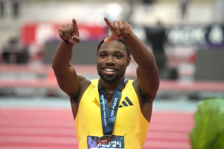 Feb 17, 2024; Albuquerque, NM, USA; Noah Lyles gestures after winning the 60m in 6.43 during the USATF Indoor Championships at Albuquerque Convention Center. Mandatory Credit: Kirby Lee-USA TODAY Sports