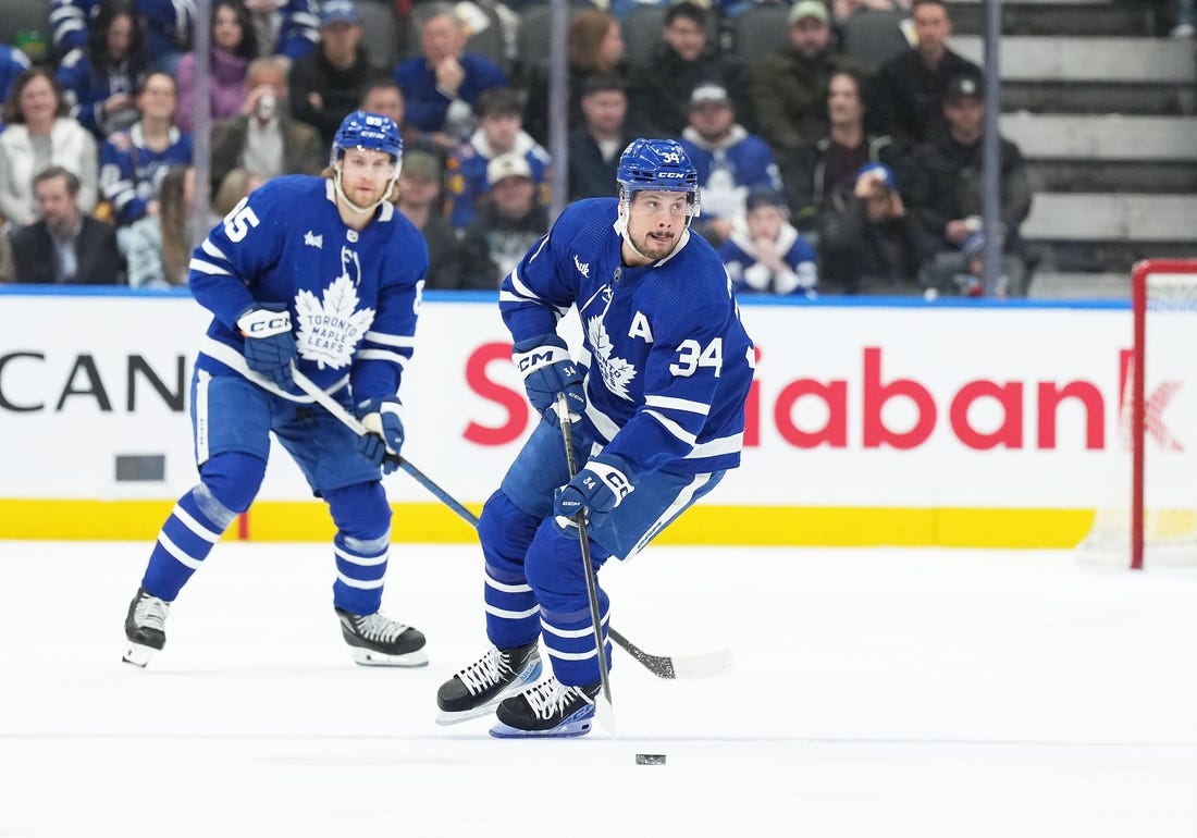 Feb 17, 2024; Toronto, Ontario, CAN; Toronto Maple Leafs center Auston Matthews (34) skates with the puck against the Anaheim Ducks during the first period at Scotiabank Arena. Mandatory Credit: Nick Turchiaro-USA TODAY Sports