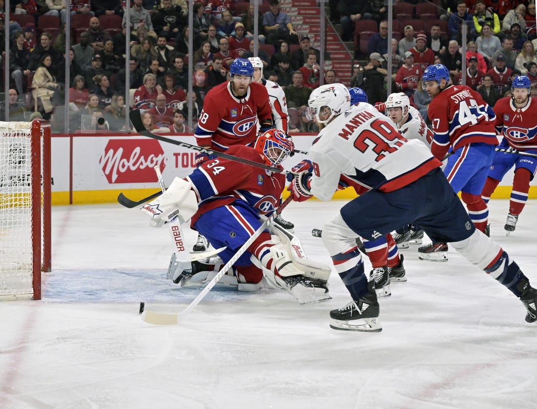 Feb 17, 2024; Montreal, Quebec, CAN; Washington Capitals forward Anthony Mantha (39) scores a goal against Montreal Canadiens goalie Jake Allen (34) during the first period at the Bell Centre. Mandatory Credit: Eric Bolte-USA TODAY Sports