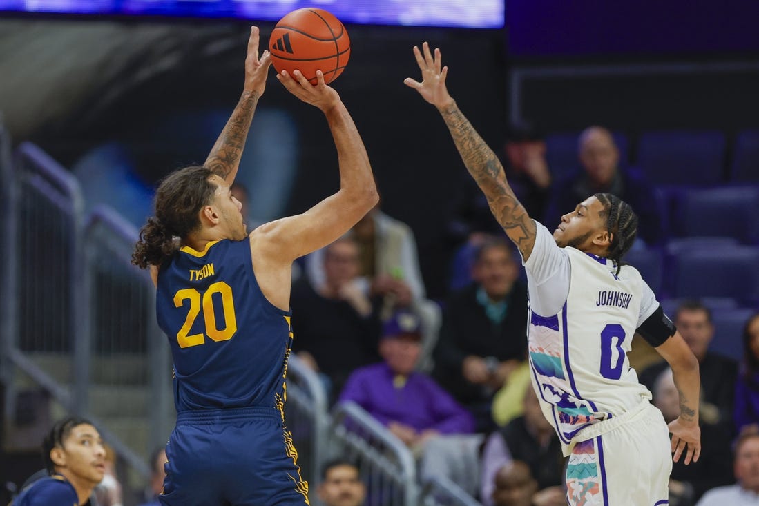 Feb 17, 2024; Seattle, Washington, USA; California Golden Bears guard Jaylon Tyson (20) makes a three-pointer against Washington Huskies guard Koren Johnson (0) during the first half at Alaska Airlines Arena at Hec Edmundson Pavilion. Mandatory Credit: Joe Nicholson-USA TODAY Sports