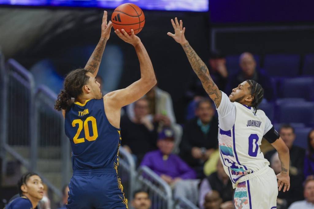 Feb 17, 2024; Seattle, Washington, USA; California Golden Bears guard Jaylon Tyson (20) makes a three-pointer against Washington Huskies guard Koren Johnson (0) during the first half at Alaska Airlines Arena at Hec Edmundson Pavilion. Mandatory Credit: Joe Nicholson-USA TODAY Sports