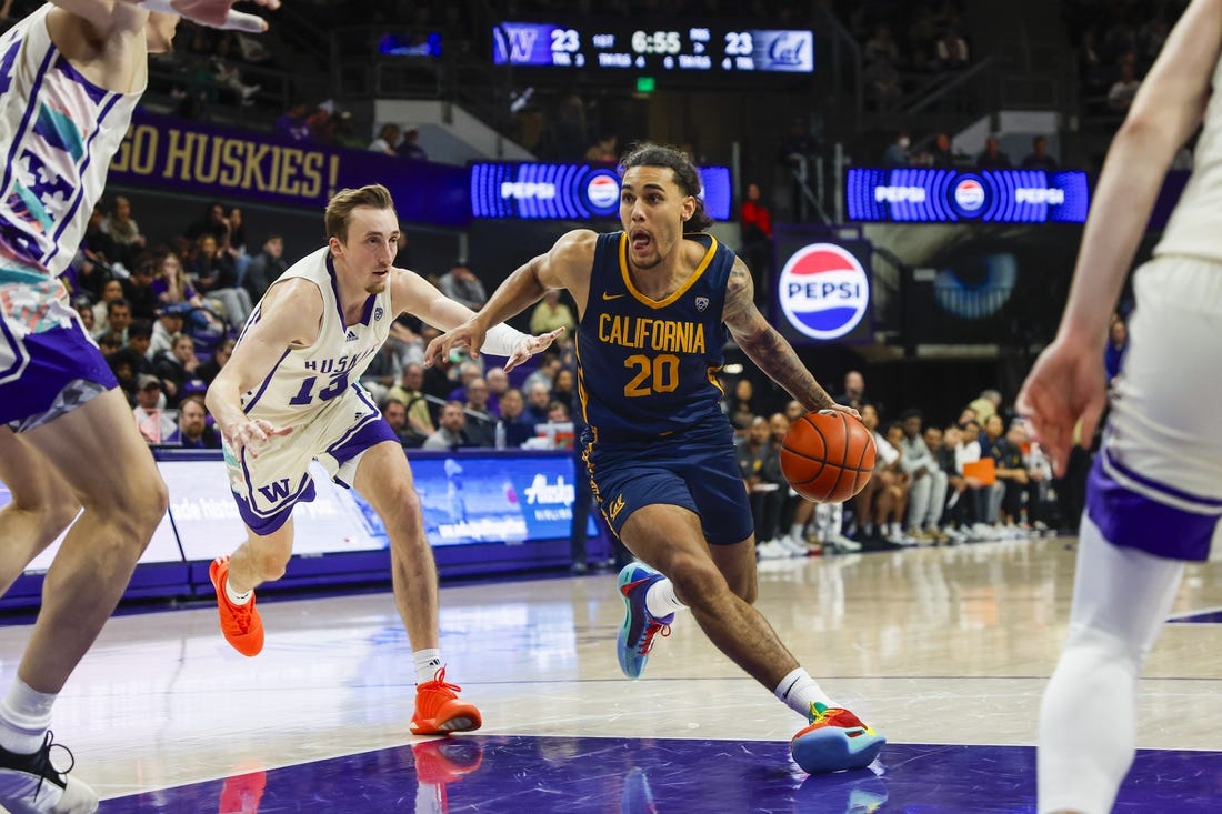 Feb 17, 2024; Seattle, Washington, USA; California Golden Bears guard Jaylon Tyson (20) dribbles past Washington Huskies forward Moses Wood (13) during the first half at Alaska Airlines Arena at Hec Edmundson Pavilion. Mandatory Credit: Joe Nicholson-USA TODAY Sports