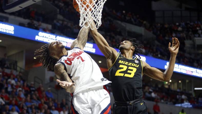 Feb 17, 2024; Oxford, Mississippi, USA; Mississippi Rebels guard Allen Flanigan (7) and Missouri Tigers forward Aidan Shaw (23) battle for a rebound during the first half at The Sandy and John Black Pavilion at Ole Miss. Mandatory Credit: Petre Thomas-USA TODAY Sports