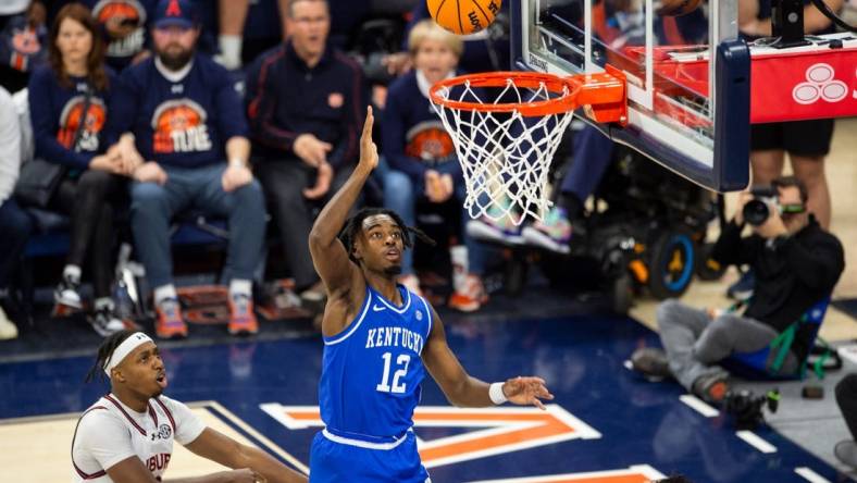 Kentucky Wildcats guard Antonio Reeves (12) goes up for a layup as Auburn Tigers take on Kentucky Wildcats at Neville Arena in Auburn, Ala., on Saturday, Feb. 17, 2024. Kentucky Wildcats defeated Auburn Tigers 70-59.