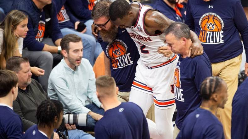 Auburn Tigers forward Jaylin Williams (2) leaves the game with an apparent knee injury as Auburn Tigers take on Kentucky Wildcats at Neville Arena in Auburn, Ala., on Saturday, Feb. 17, 2024. Kentucky Wildcats defeated Auburn Tigers 70-59.