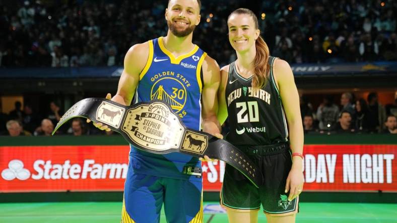 Feb 17, 2024; Indianapolis, IN, USA; Golden State Warriors guard Stephen Curry (30) and New York Liberty guard Sabrina Ionescu (20) after the Stephen vs Sebrina three-point challenge during NBA All Star Saturday Night at Lucas Oil Stadium. Mandatory Credit: Kyle Terada-USA TODAY Sports