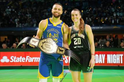 Feb 17, 2024; Indianapolis, IN, USA; Golden State Warriors guard Stephen Curry (30) and New York Liberty guard Sabrina Ionescu (20) after the Stephen vs Sebrina three-point challenge during NBA All Star Saturday Night at Lucas Oil Stadium. Mandatory Credit: Kyle Terada-USA TODAY Sports