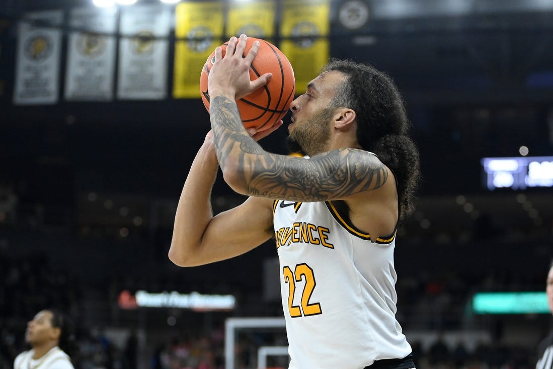 Feb 17, 2024; Providence, Rhode Island, USA; Providence Friars guard Devin Carter (22) shoots the ball against the DePaul Blue Demons during the first half at Amica Mutual Pavilion. Mandatory Credit: Eric Canha-USA TODAY Sports