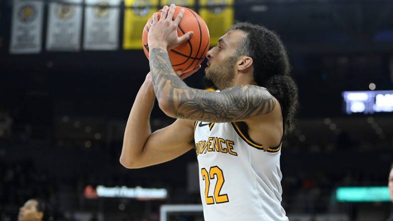 Feb 17, 2024; Providence, Rhode Island, USA; Providence Friars guard Devin Carter (22) shoots the ball against the DePaul Blue Demons during the first half at Amica Mutual Pavilion. Mandatory Credit: Eric Canha-USA TODAY Sports