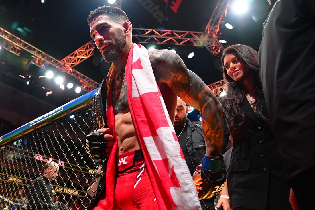 Feb 17, 2024; Anaheim, California, USA; Ilia Topuria celebrates his championship victory against Alexander Volkanovski during UFC 298 at Honda Center. Mandatory Credit: Gary A. Vasquez-USA TODAY Sports