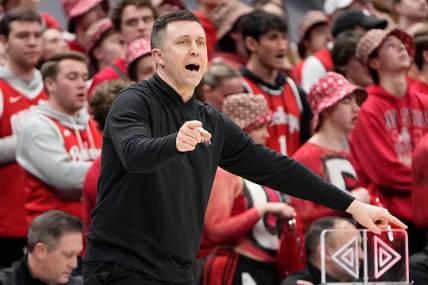 Feb 18, 2024; Columbus, Ohio, USA; Ohio State Buckeyes interim head coach Jake Diebler motions from the bench during the second half of the NCAA men   s basketball game against the Purdue Boilermakers at Value City Arena. Ohio State won 73-69.