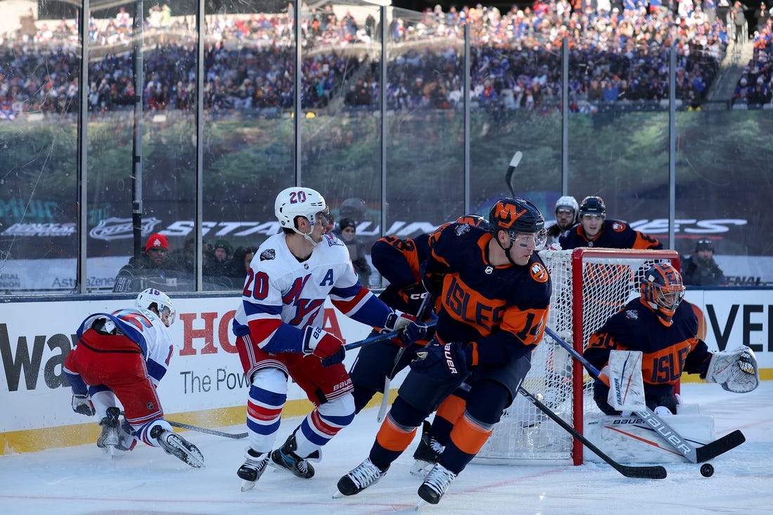 Feb 18, 2024; East Rutherford, New Jersey, USA; New York Islanders goaltender Ilya Sorokin (30) plays the puck against New York Rangers left wing Chris Kreider (20) during the first period of a Stadium Series ice hockey game at MetLife Stadium. Mandatory Credit: Brad Penner-USA TODAY Sports