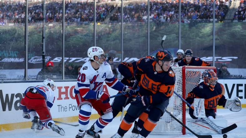 Feb 18, 2024; East Rutherford, New Jersey, USA; New York Islanders goaltender Ilya Sorokin (30) plays the puck against New York Rangers left wing Chris Kreider (20) during the first period of a Stadium Series ice hockey game at MetLife Stadium. Mandatory Credit: Brad Penner-USA TODAY Sports