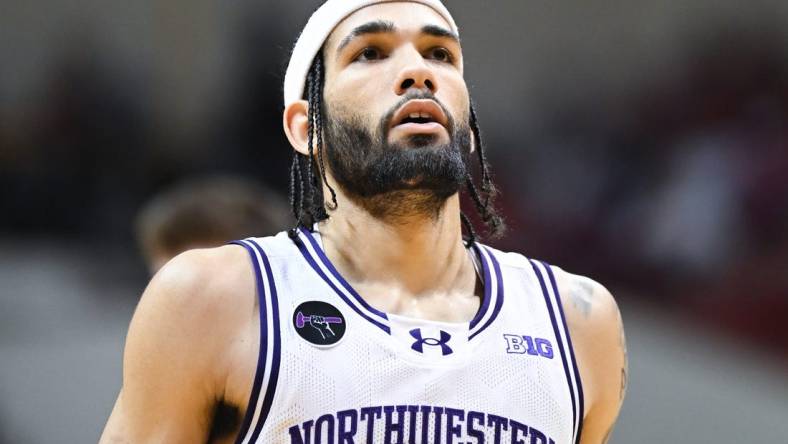 Feb 18, 2024; Bloomington, Indiana, USA;  Northwestern Wildcats guard Boo Buie (0) waits to attempt a free throw against the Indiana Hoosiers during the second half at Simon Skjodt Assembly Hall. Mandatory Credit: Robert Goddin-USA TODAY Sports