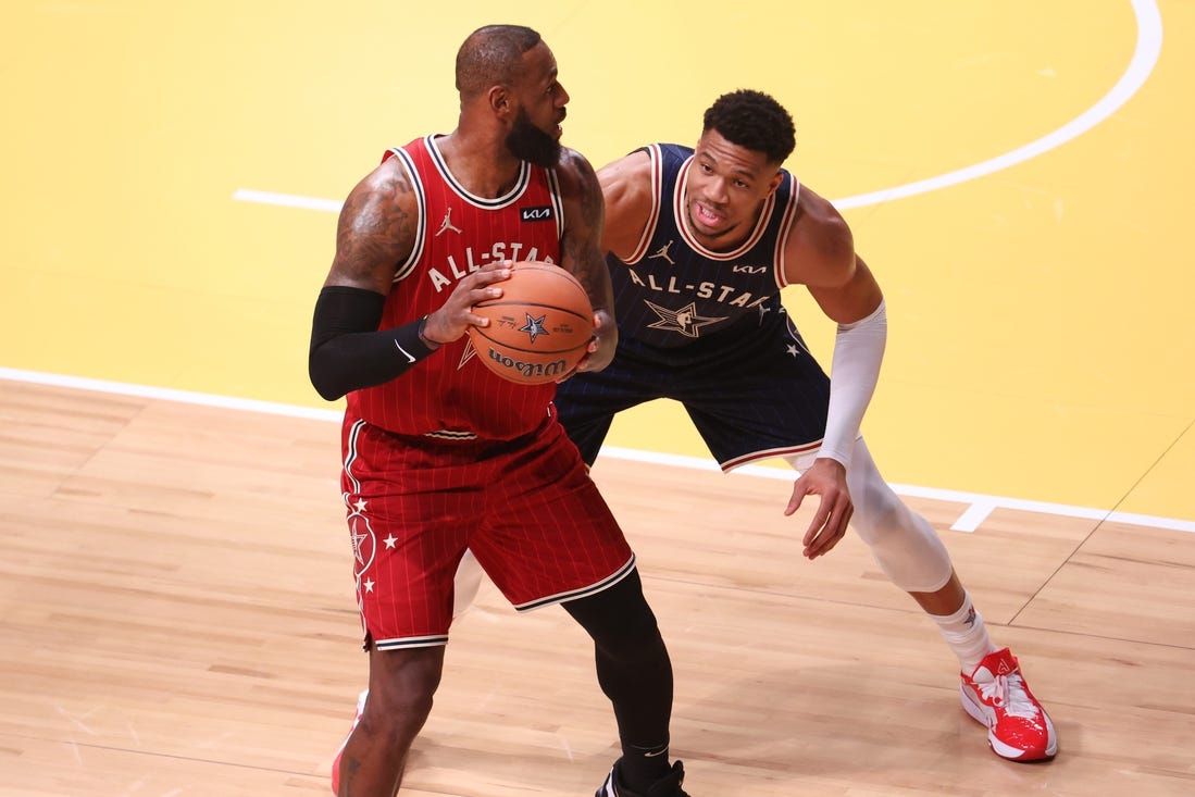 Feb 18, 2024; Indianapolis, Indiana, USA; Eastern Conference forward Giannis Antetokounmpo (34) of the Milwaukee Bucks defends Western Conference forward LeBron James (23) of the Los Angeles Lakers during the first quarter in the 73rd NBA All Star game at Gainbridge Fieldhouse. Mandatory Credit: Trevor Ruszkowski-USA TODAY Sports