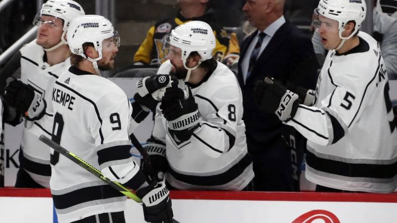 Feb 18, 2024; Pittsburgh, Pennsylvania, USA;  Los Angeles Kings right wing Adrian Kempe (9) celebrates with the Kings bench after scoring the game winning goal against the Pittsburgh Penguins during the third period at PPG Paints Arena. Los Angeles won 2-1. Mandatory Credit: Charles LeClaire-USA TODAY Sports