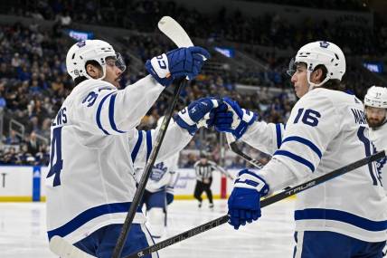 Feb 19, 2024; St. Louis, Missouri, USA;  Toronto Maple Leafs center Auston Matthews (34) celebrates with right wing Mitchell Marner (16) after scoring against the St. Louis Blues during the third period at Enterprise Center. Mandatory Credit: Jeff Curry-USA TODAY Sports