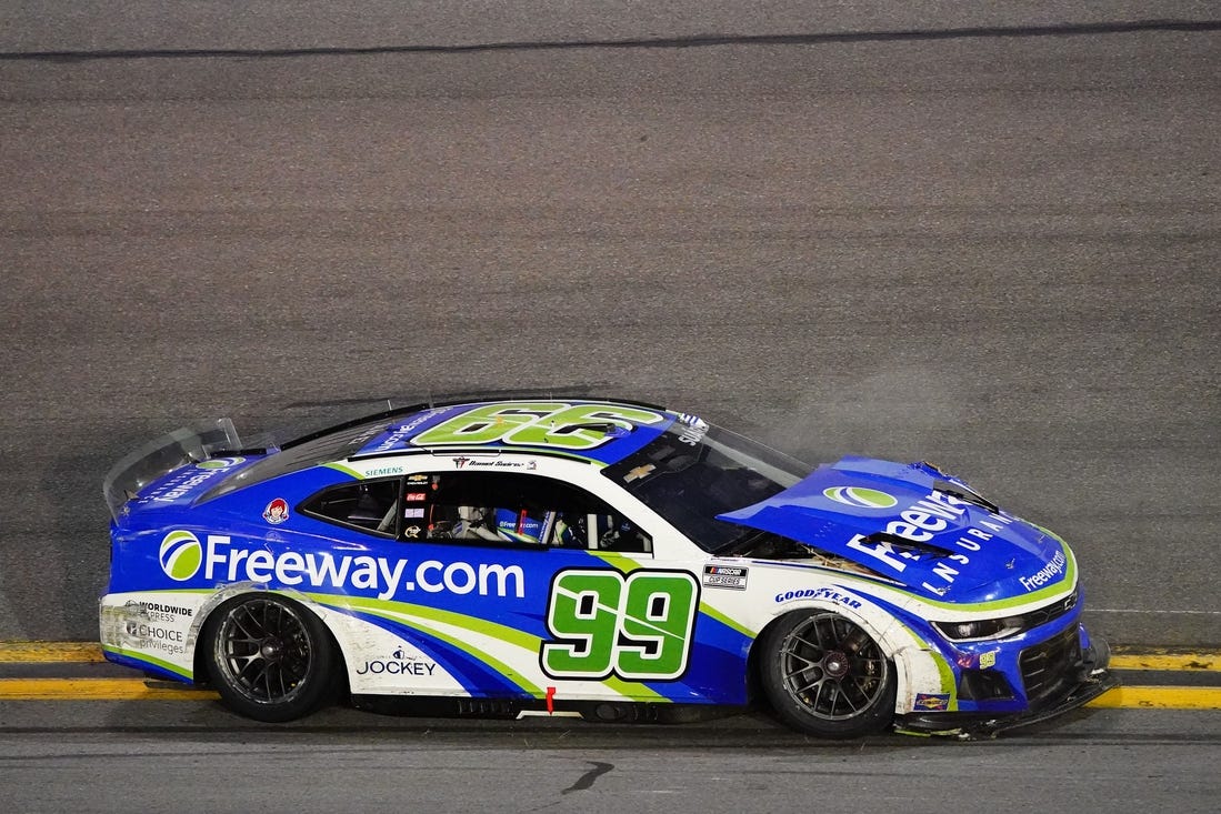 Feb 19, 2024; Daytona Beach, Florida, USA; NASCAR Cup Series driver Daniel Suarez (99) wrecks during the Daytona 500 at Daytona International Speedway. Mandatory Credit: John David Mercer-USA TODAY Sports